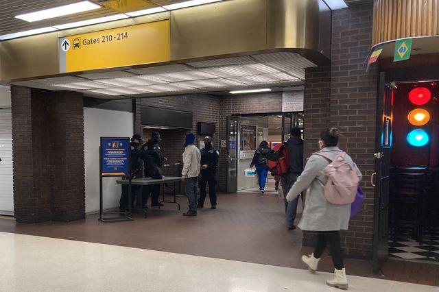 Port Authority Police conducting routine bag checks on commuters. They will soon begin checking luggage for guns on buses arriving from out of state.